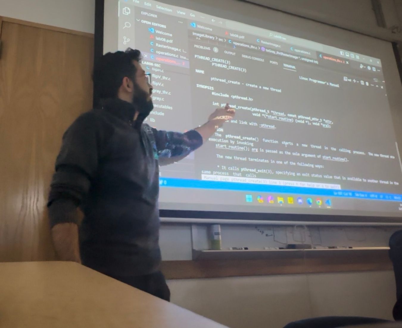 Ayman's pointing out something on a screen