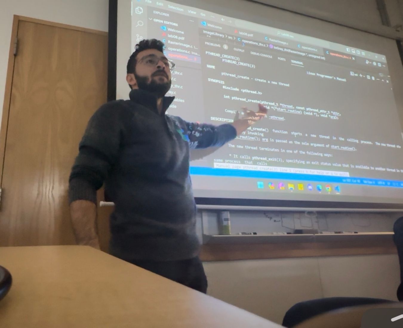 Ayman's pointing out something on a screeen